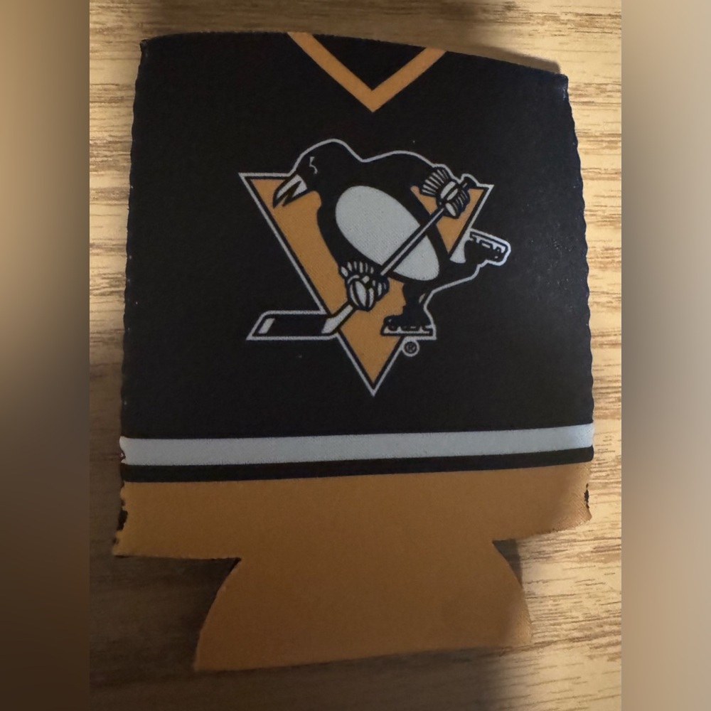 Pittsburgh Penguins drink can holder. Local casino branding on the back